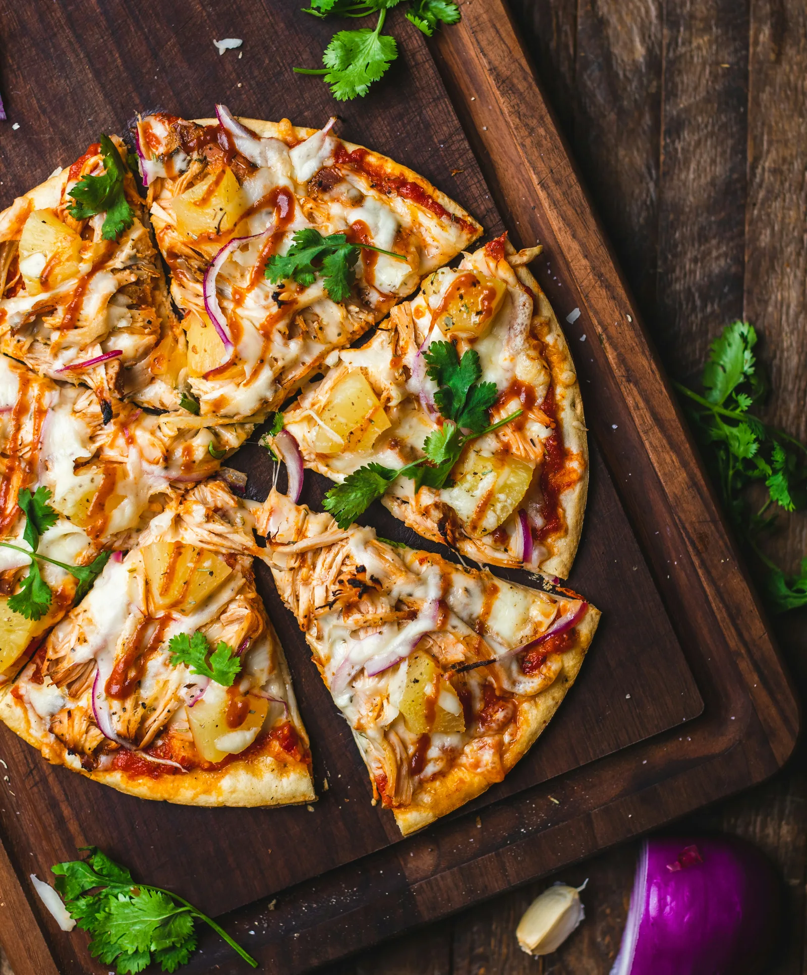Catering spread of assorted pizzas